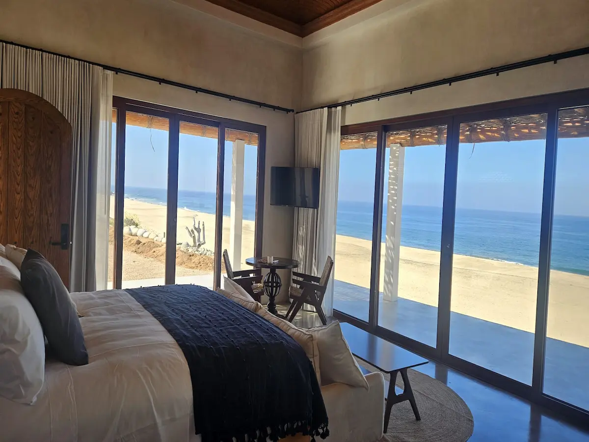 Ocean-facing suite with warm wood finishes